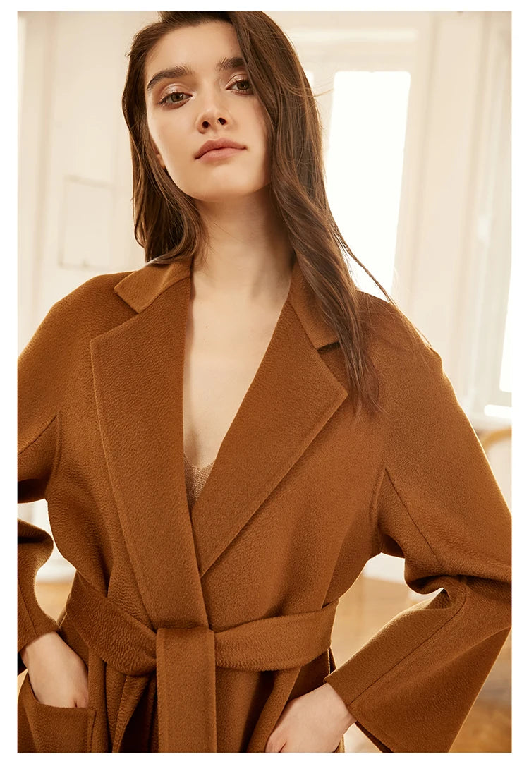 Model wearing a sienna double-sided cashmere wrap coat, cropped upper section. From Borcelleclothes.