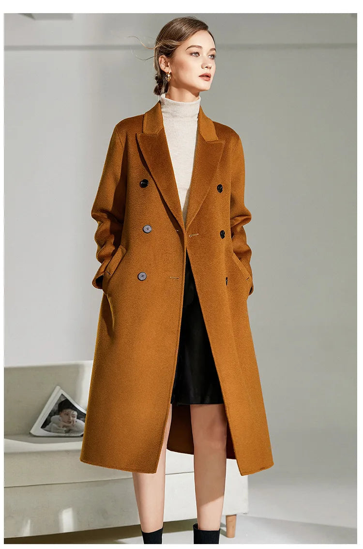 Model in Women's Double-Sided Wool-Cashmere Coat in Bourbon, looking side. From Borcelleclothes.