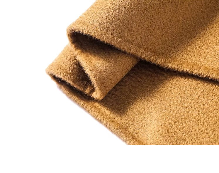 The bottom hem of the Women's Double-Sided Wool-Cashmere Coat in Brown Sugar, showcasing its sharp and streamlined tailoring. From Borcelleclothes.