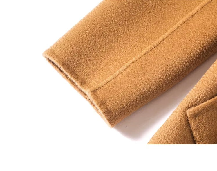 The sleeve of the Women's Double-Sided Wool-Cashmere Coat in Brown Sugar, emphasizing the clean stitching and tailored design. From Borcelleclothes.