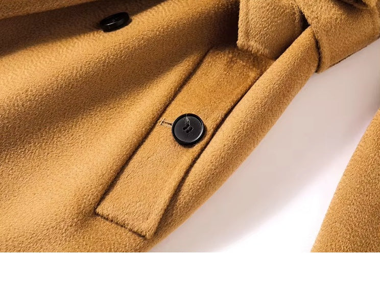 The diagonally exposed single-welt pocket with a buttonhole on the Women's Double-Sided Wool-Cashmere Coat in Brown Sugar. From Borcelleclothes.