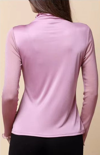 The back of a model wearing women's dual-layer silk top in Lily, showing the single silk layer and ruffled high neck. From Borcelleclothes.