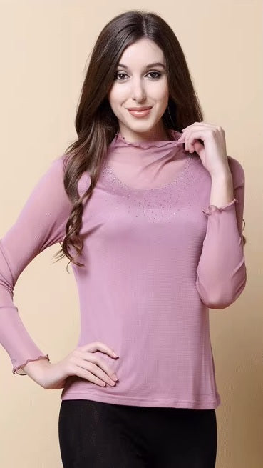 Model wearing women's dual-layer silk top in Lily, touching the gauze silk collar with rhinestone accents, emphasizing the ruffled high neck by Borcelleclothes.