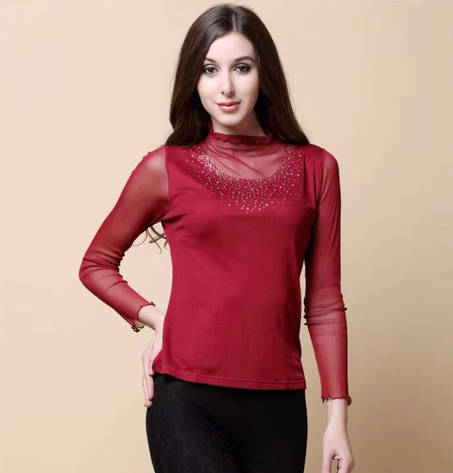 Model wearing women's dual-layer silk top in Vivid Burgundy, with her hand on the hip. From Borcelleclothes.