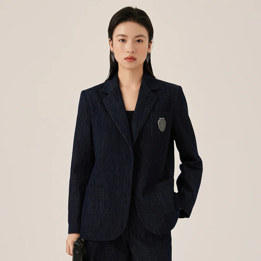 Women's Ebony Clay denim blazer with classic lines and rhinestone badge. A structure that keeps formality yet allows freedom of style. From Borcelleclothes.