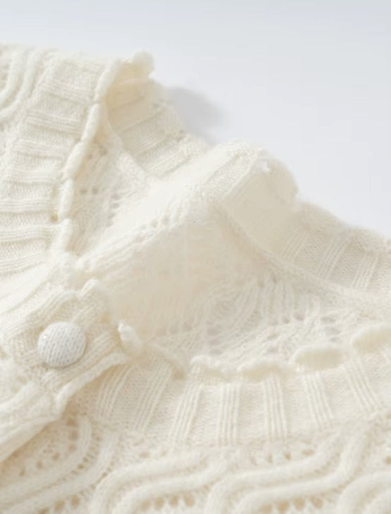 The collar on the women's Embossed Lace Cashmere Cardigan in Pearl Bush, featuring scalloped edges and delicate lace details, Borcelleclothes.