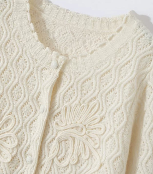 The upper part of the women's Embossed Lace Cashmere Cardigan in Pearl Bush, showcasing the intricate lace design and soft cashmere texture, Borcelleclothes.