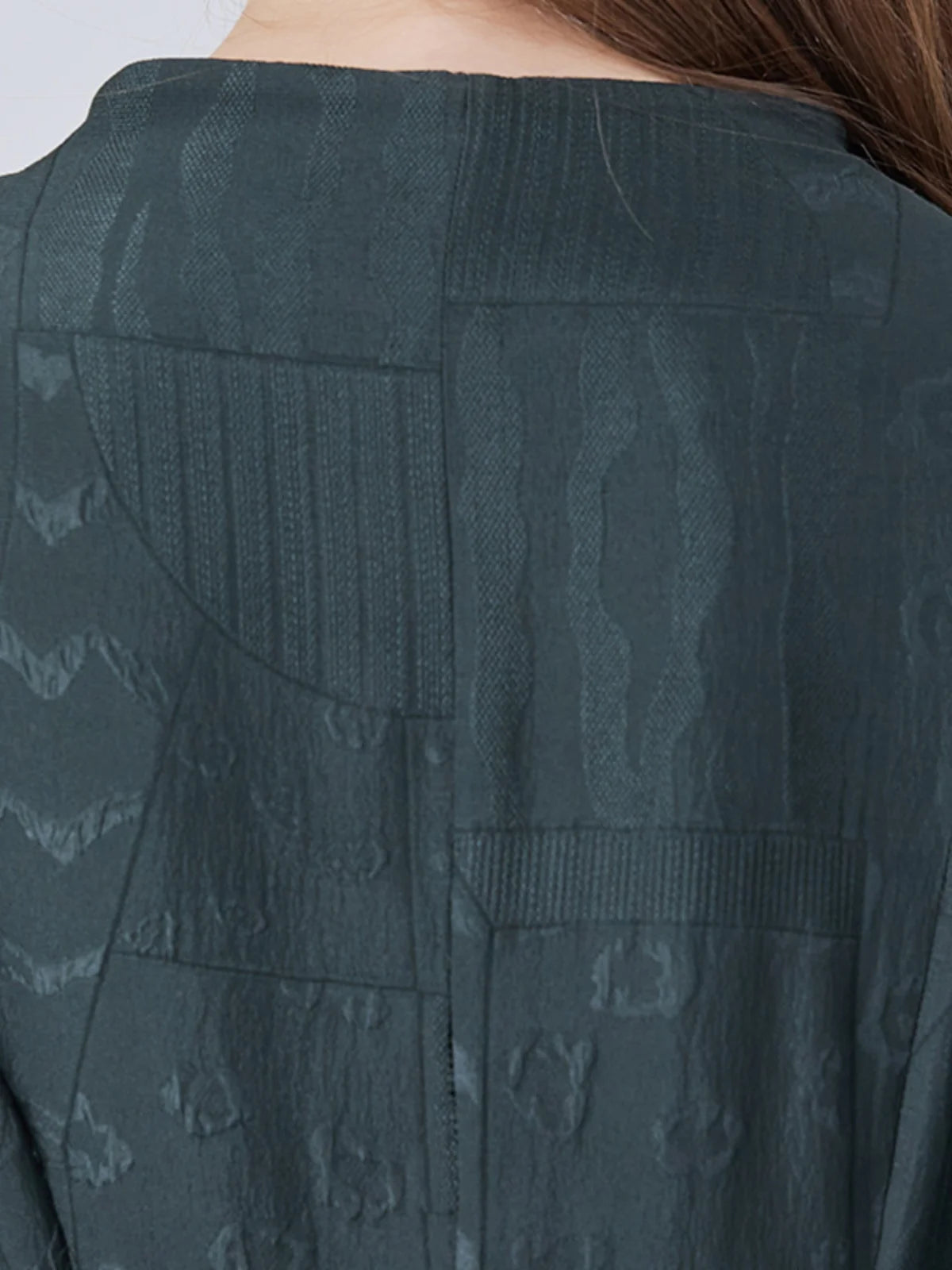 Back upper part of the dress with visible embroidery and seams. From Borcelleclothes.