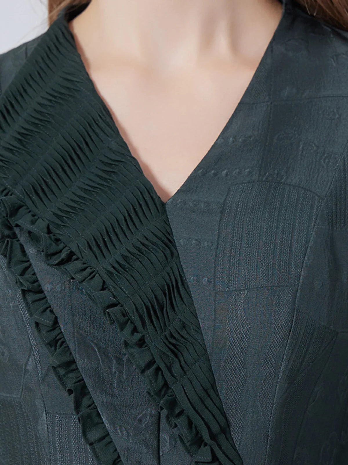 Front upper view of the dress, showing asymmetrical lapel and neckline. From Borcelleclothes.