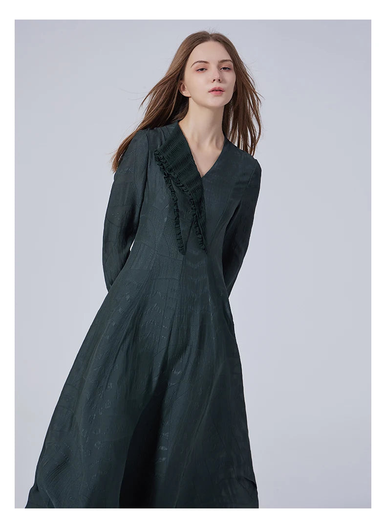 Model slightly bent forward in the embroidered jacquard silk dress. From Borcelleclothes.