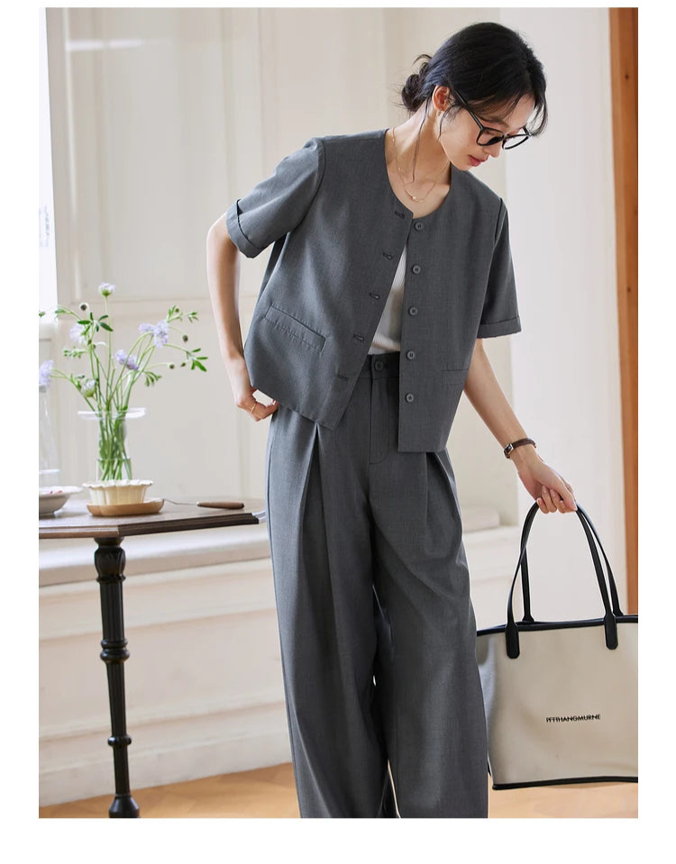 Model in Fiord set with bent posture, looking downward. From Borcelleclothes.