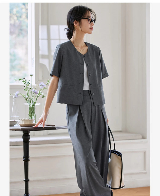 Women's two-piece set in Fiord grey-blue — features a short five-button jacket and wide-leg trousers with crossed front pleats, crafted in fluid, softly textured fabric. From Borcelleclothes.
