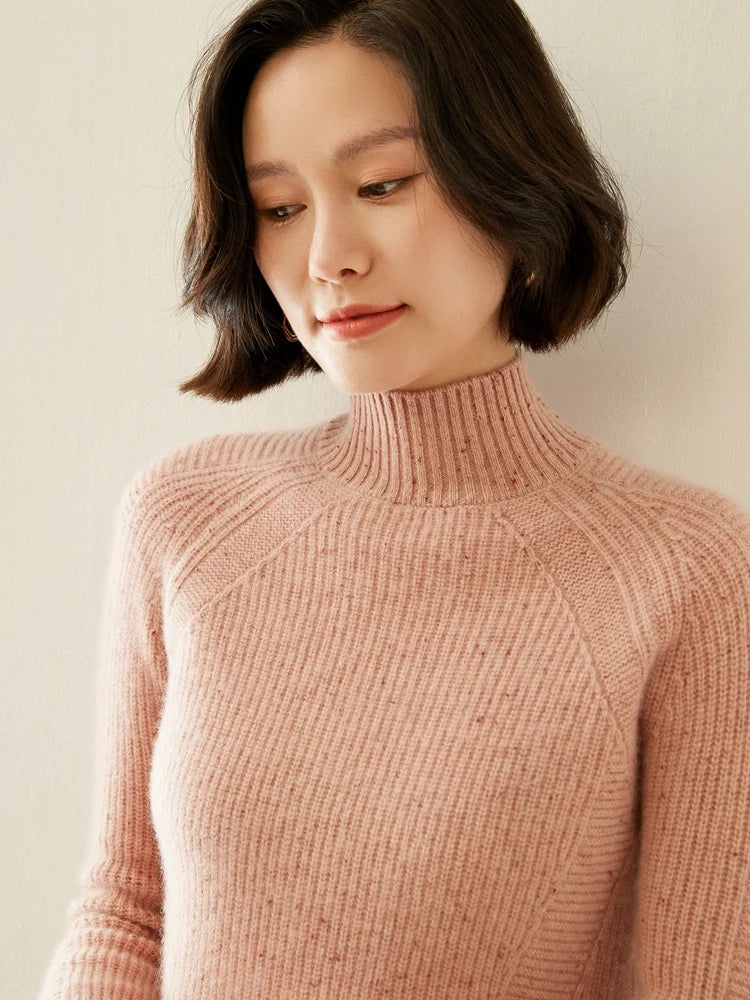 Upper part of Delicate Bloom sweater on model, highlighting mock neck and angled chest lines — From Borcelleclothes.