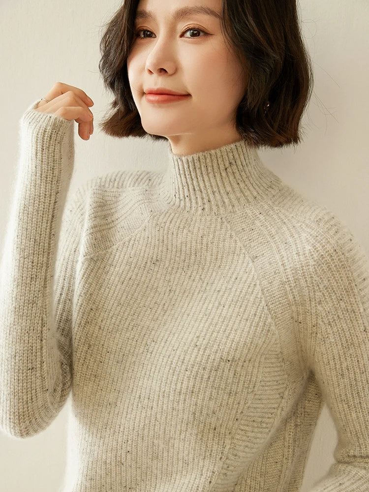 Fern Breeze sweater with model’s bent arm, drawing attention to the sculpted sleeve lines — From Borcelleclothes.