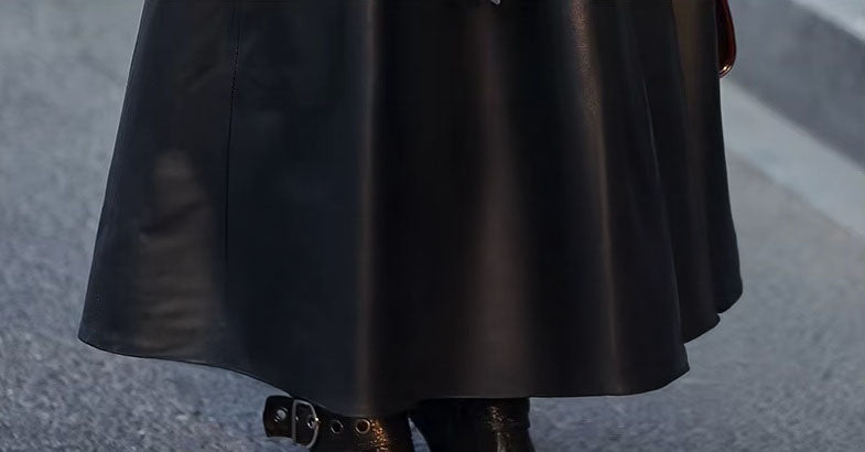 Women's Flared Hooded Coat in Onyx. Lower section revealing the graceful flare and impeccable leather drape. Borcelleclothes.