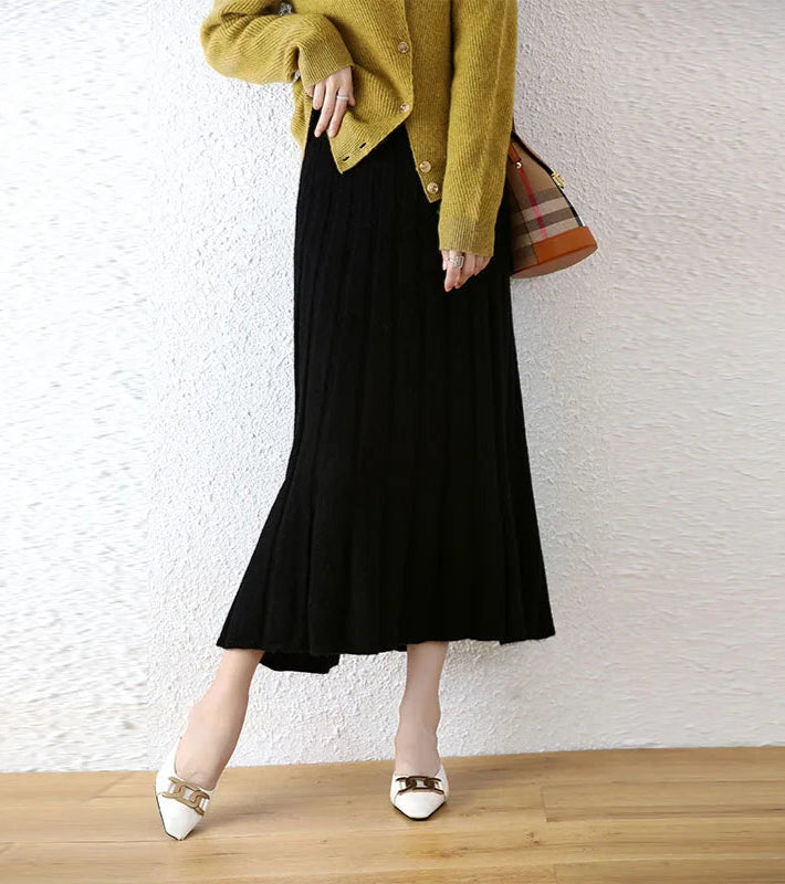 Women's Wool skirt In Onyx, with expanding pleats and soft volume near the hem — From Borcelleclothes.
