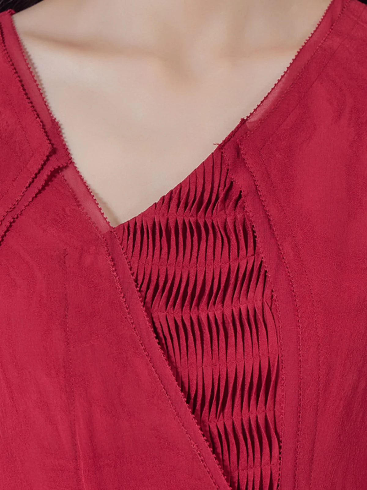 Front upper view of the Georgette-Jacquard silk dress highlighting the asymmetrical neckline and layered yoke. From Borcelleclothes.