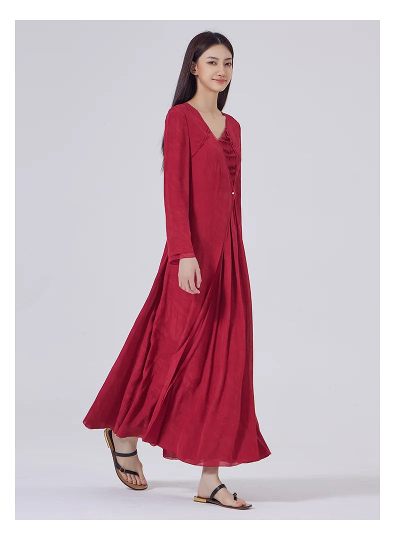 Side walking pose revealing the layered silhouette and flowing movement of the silk dress. From Borcelleclothes.