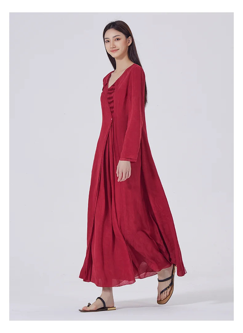 Side view while walking, showcasing the fluidity of the layered silk panels and calf-length hem. From Borcelleclothes.