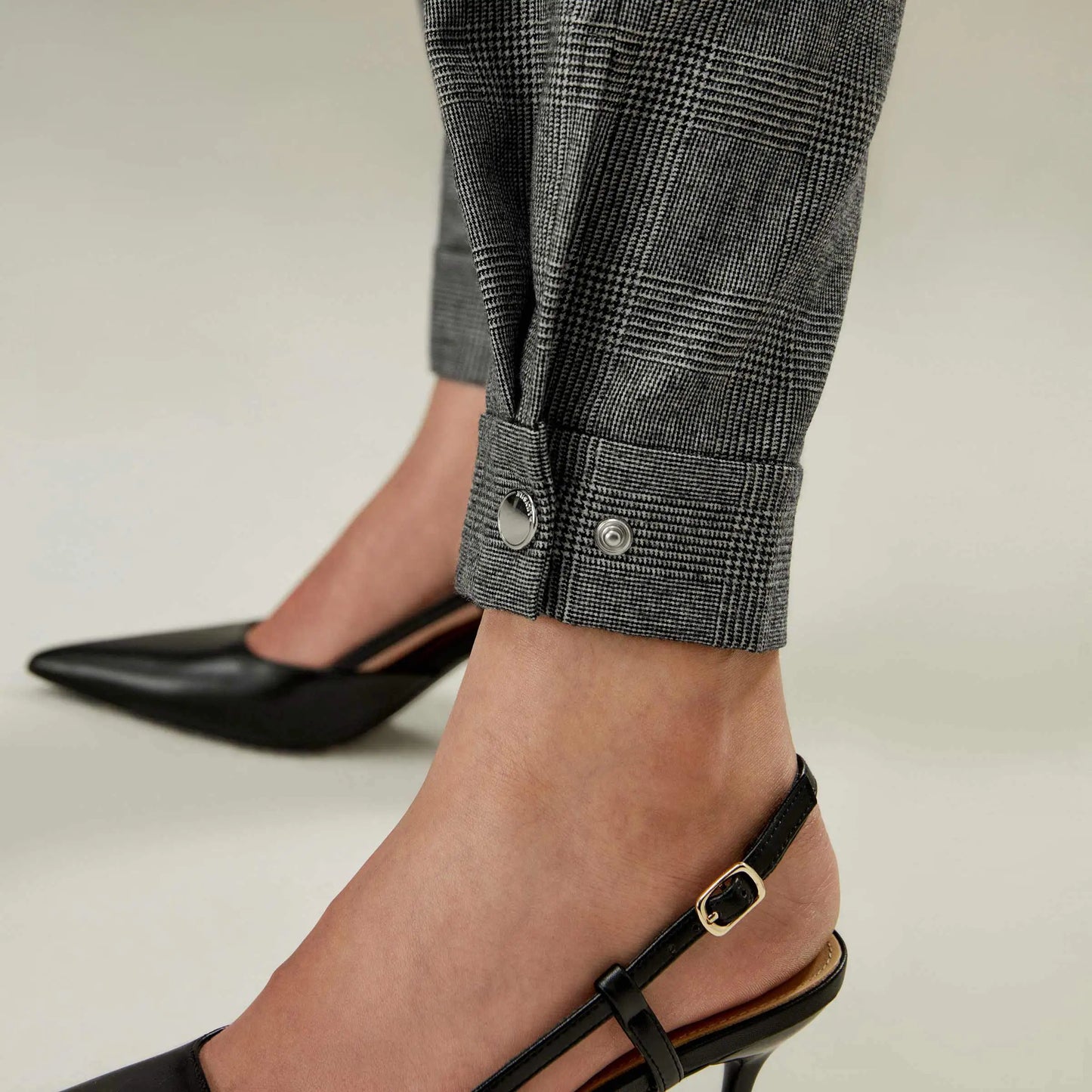 Close view of the cuff on Glen Check wool trousers in Concord, emphasizing the precise cut and modern inspiration. From Borcelleclothes.