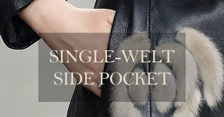 Women's Goatskin Down Coat in Onyx. Model places hand in pocket, with mink fur appliqué detail subtly enhancing the design. Borcelleclothes.