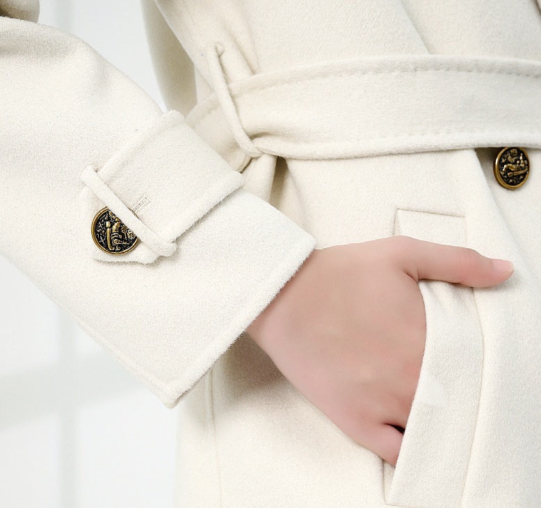 The hand pocket on the Women's Grade A Cashmere Coat in Floral White, showcasing its seamless integration and refined craftsmanship. From Borcelleclothes.