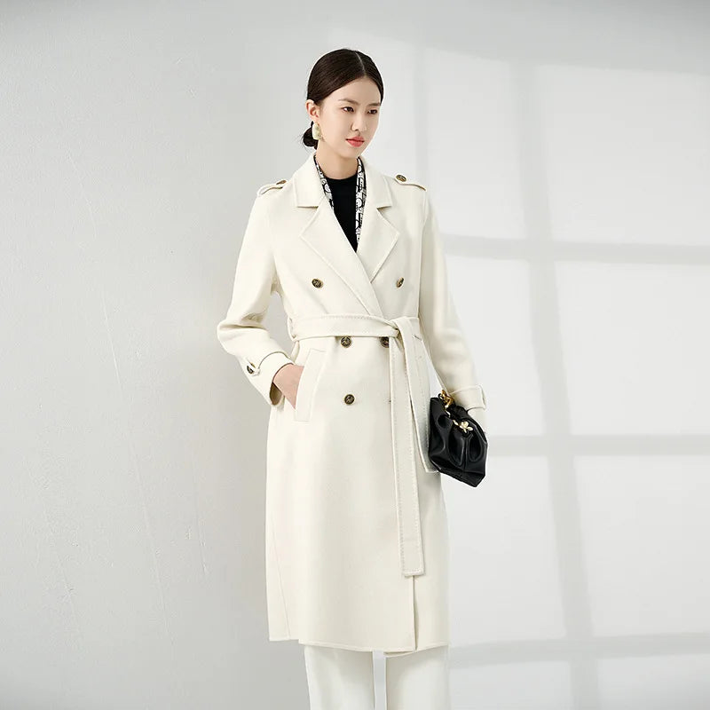 Women's Grade A Cashmere Coat in Floral White—crafted from 100% double-sided Grade A cashmere for unmatched softness and refinement. Featuring a double-breasted silhouette, embossed buttons, shoulder tabs, and decorative sleeve details, this mid-calf coat embodies timeless elegance and commanding presence. From Borcelleclothes.