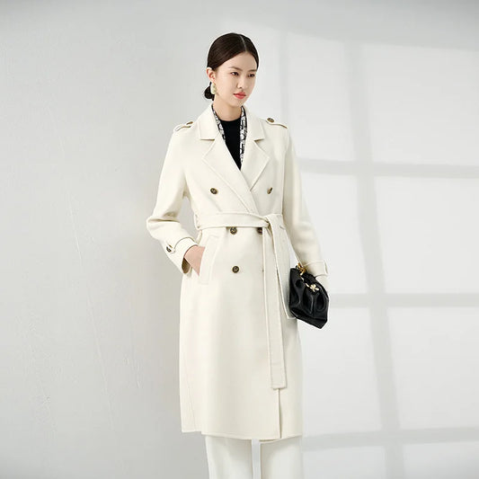 Women's Grade A Cashmere Coat in Floral White—crafted from 100% double-sided Grade A cashmere for unmatched softness and refinement. Featuring a double-breasted silhouette, embossed buttons, shoulder tabs, and decorative sleeve details, this mid-calf coat embodies timeless elegance and commanding presence. From Borcelleclothes.