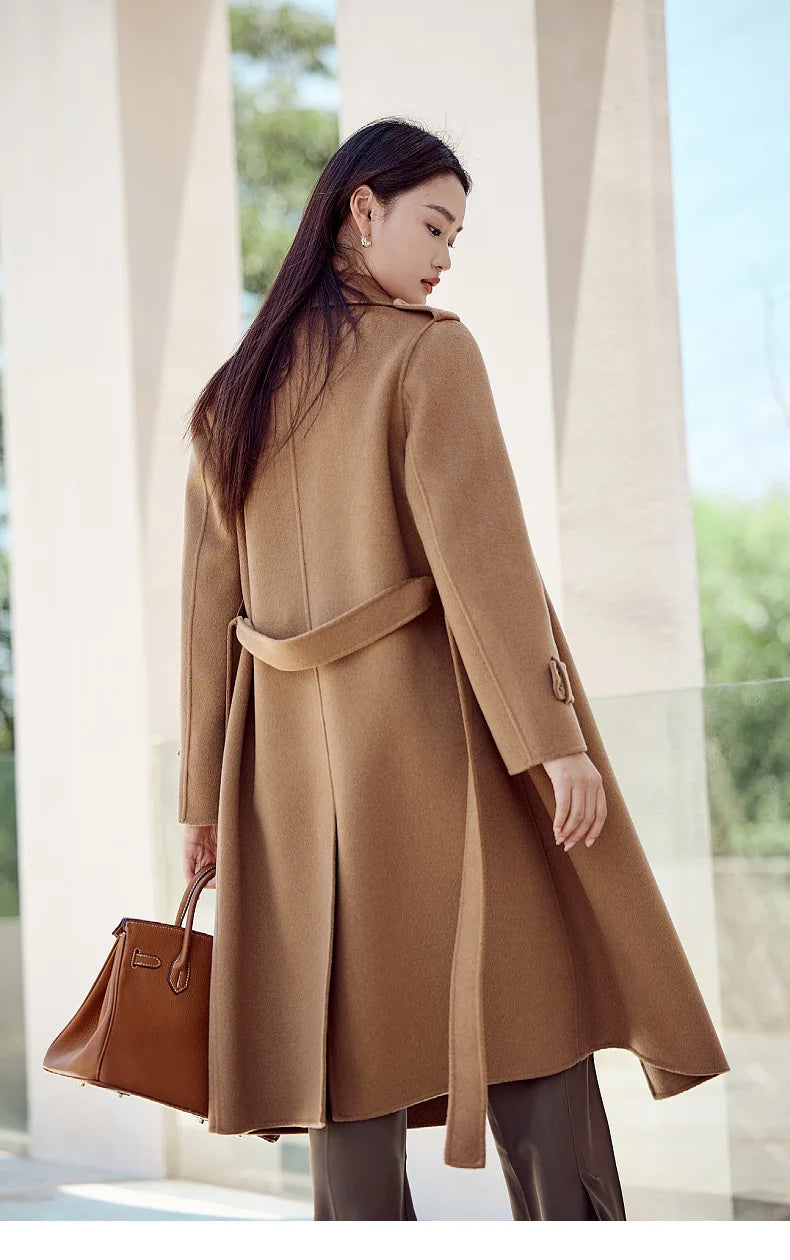 Back of the Women's Grade A Cashmere Coat in French Beige, showcasing its structured fit, shoulder tabs, and elegant mid-calf length. From Borcelleclothes.
