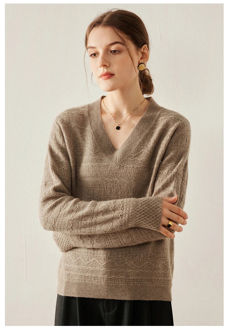 Himalayan cashmere sweater in Sweet Wood with model’s arms softly folded — From Borcelleclothes.