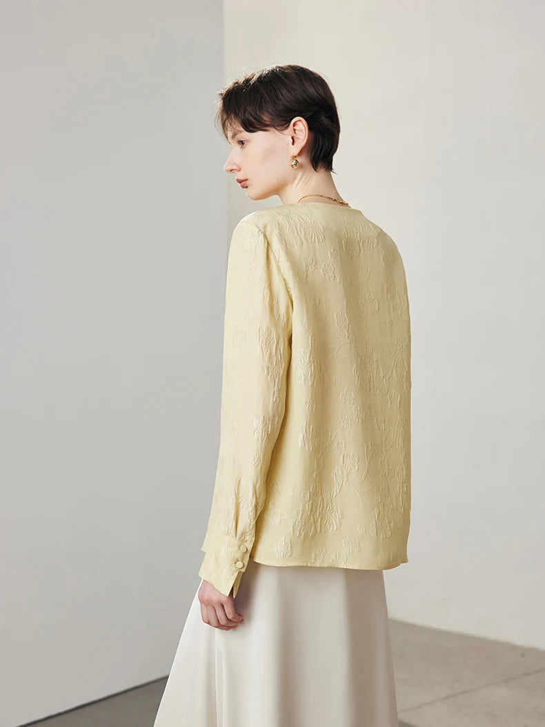 Side and back view of model wearing jacquard silk blouse in Hampton. From Borcelleclothes.