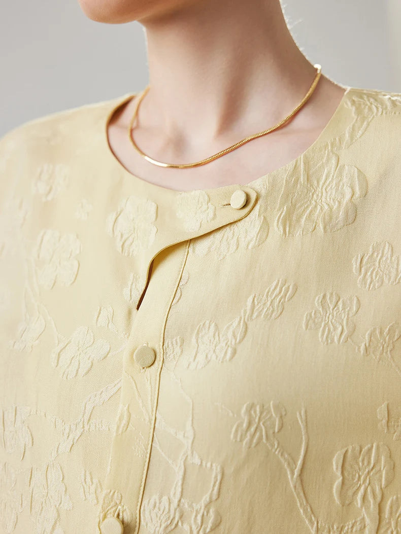 Model wearing jacquard silk blouse in Hampton, upper part with round neckline. From Borcelleclothes.