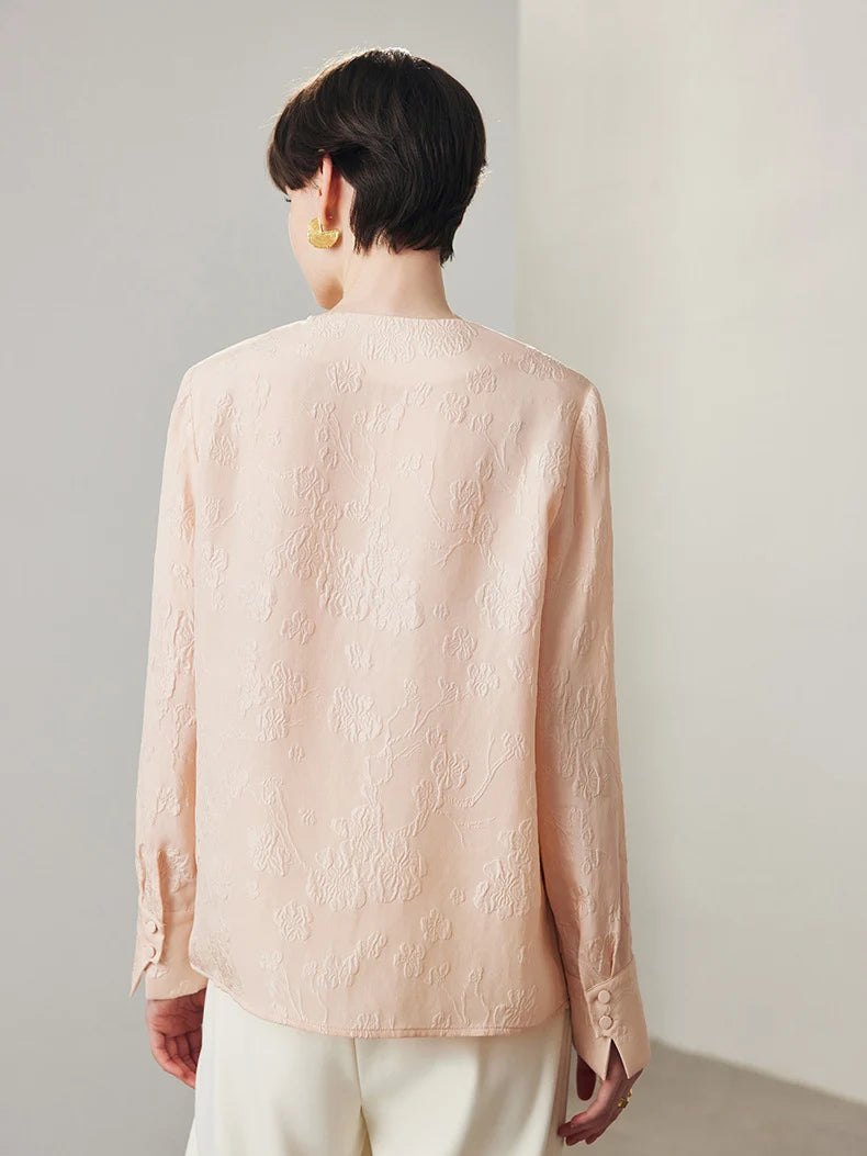 Back view of model wearing jacquard silk blouse in Oyster Pink. From Borcelleclothes.