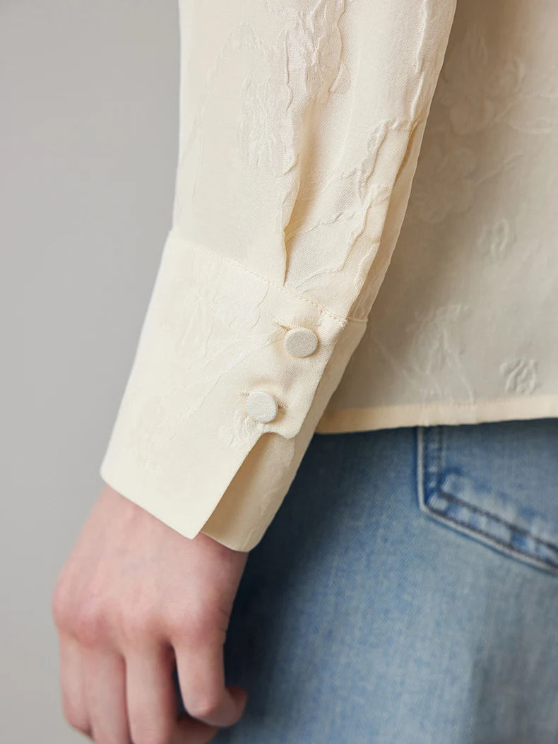 Close-up of stepped cuff with fabric-covered buttons on Pearl Bush jacquard silk blouse. From Borcelleclothes.