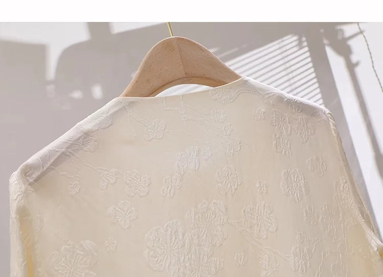 Upper back part of Pearl Bush jacquard silk blouse on hanger. From Borcelleclothes.