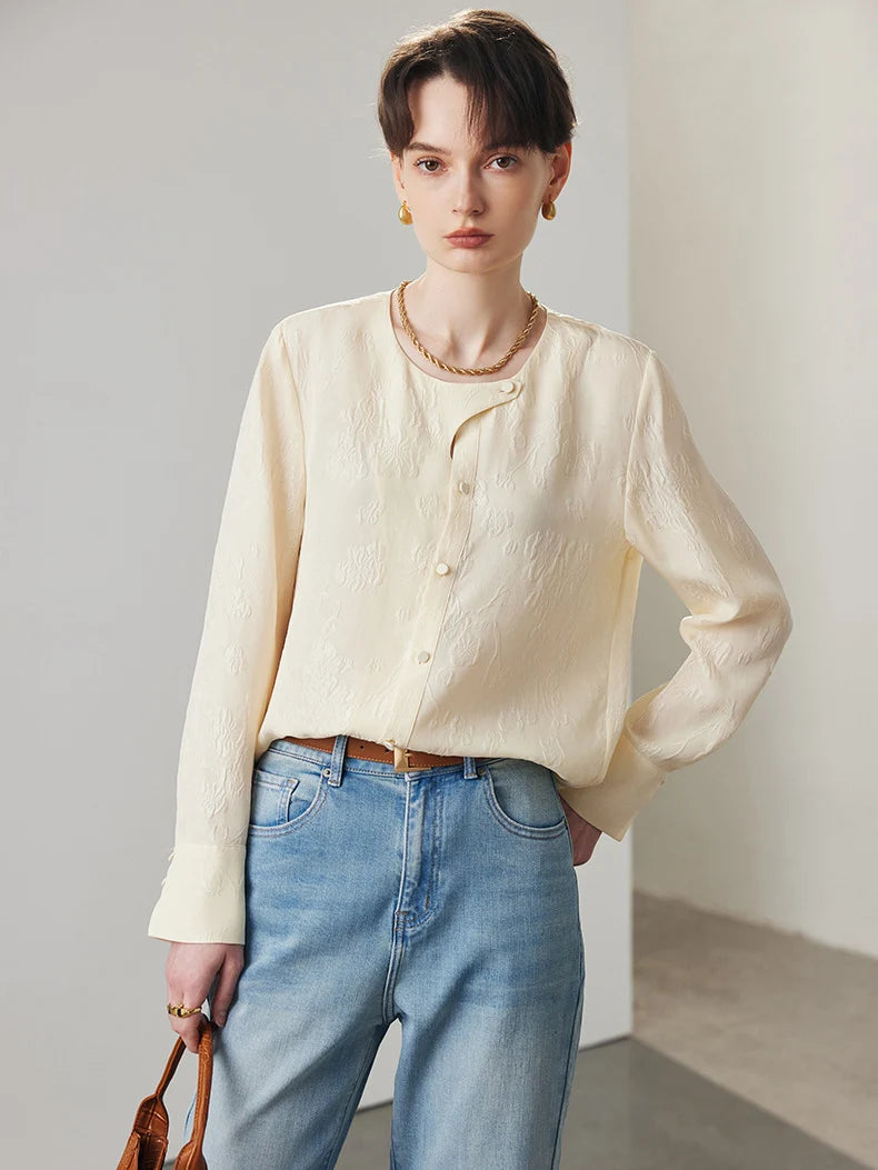 Model wearing Pearl Bush jacquard silk blouse with hand behind back. From Borcelleclothes.