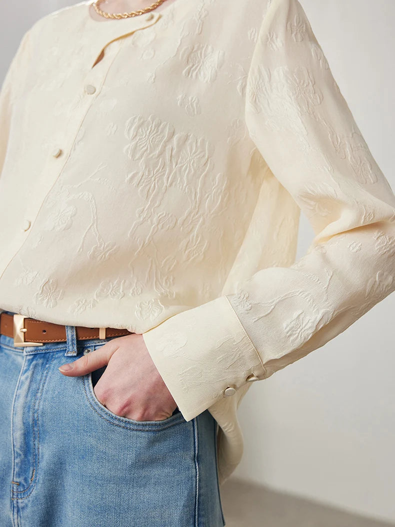 Model wearing Pearl Bush jacquard silk blouse with one hand in pants pocket. From Borcelleclothes.