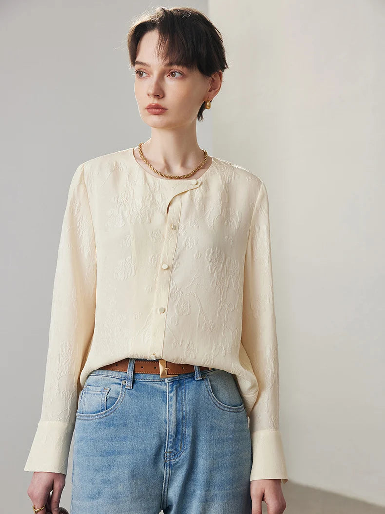 Model looking to the side in jacquard silk blouse in Pearl Bush. From Borcelleclothes.