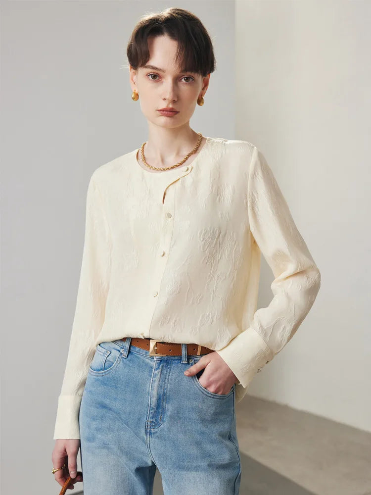 Women's jacquard silk blouse in Pearl Bush with curved placket, fabric-covered buttons, and stepped cuffs. From Borcelleclothes.