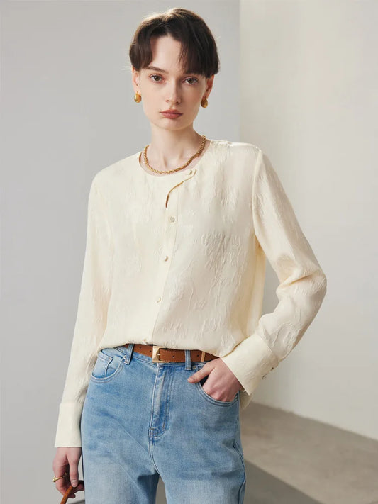 Women's jacquard silk blouse in Pearl Bush with curved placket, fabric-covered buttons, and stepped cuffs. From Borcelleclothes.