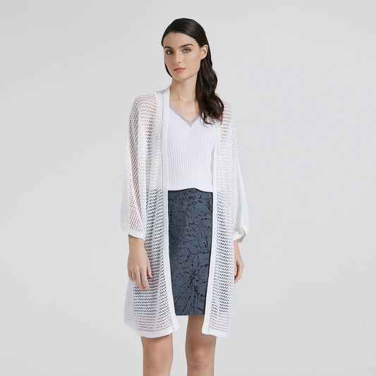 Model wearing the White Lilac kimono-style lace overlay, turned slightly with her head tilted to the side. From Borcelleclothes.