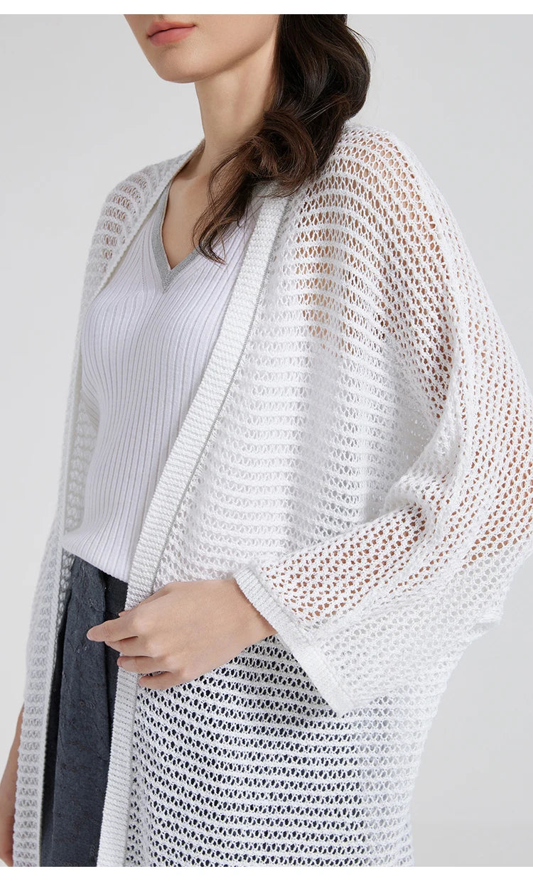 Side view of the White Lilac overlay as the model turns slightly, highlighting the sheer texture. From Borcelleclothes.