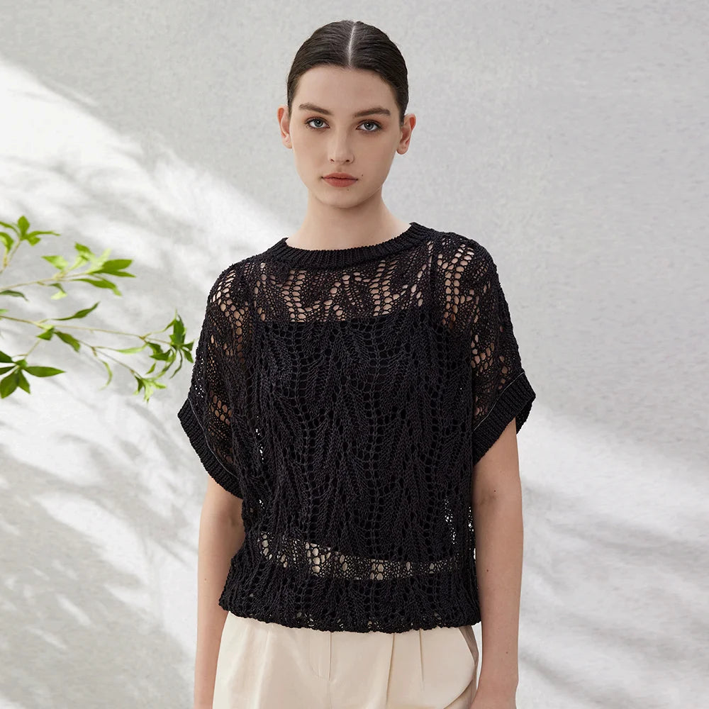 Women's linen top in Onyx with hollow leaf-pattern knit, short batwing sleeves, and chain-trimmed cuffs—structured, breathable, and visually striking. From Borcelleclothes.