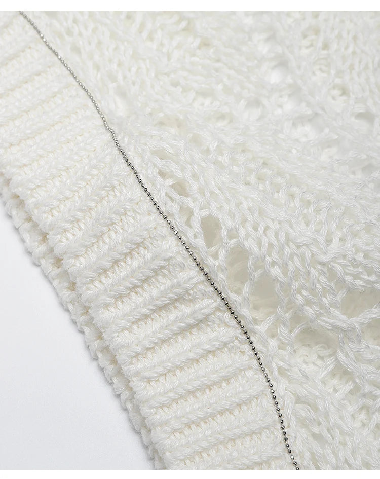 Macro detail of metal ball chain trim along the sleeve edge of the Whisper top, adding a subtle industrial accent. From Borcelleclothes.