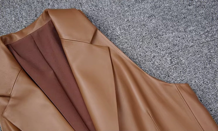 Women's Leather Midi Dress in French Beige. Detailed view of the structured lapel and precisely finished armhole, showcasing craftsmanship. Borcelleclothes.