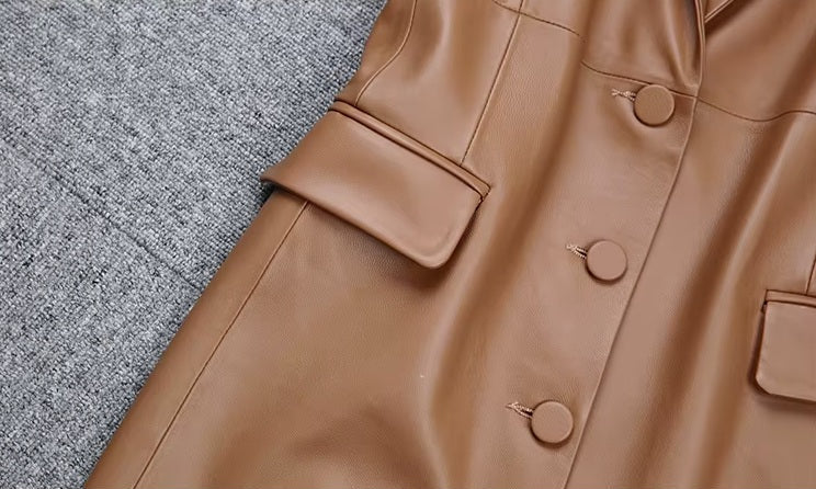 Women's Leather Midi Dress in French Beige. Focus on the front flap pockets, enhancing the dress’s structured elegance. Borcelleclothes.