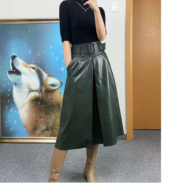 Women's Leather Midi Skirt in Lunar Green. Model leans slightly, emphasizing the skirt’s sculpted drape and graceful motion. Borcelleclothes.