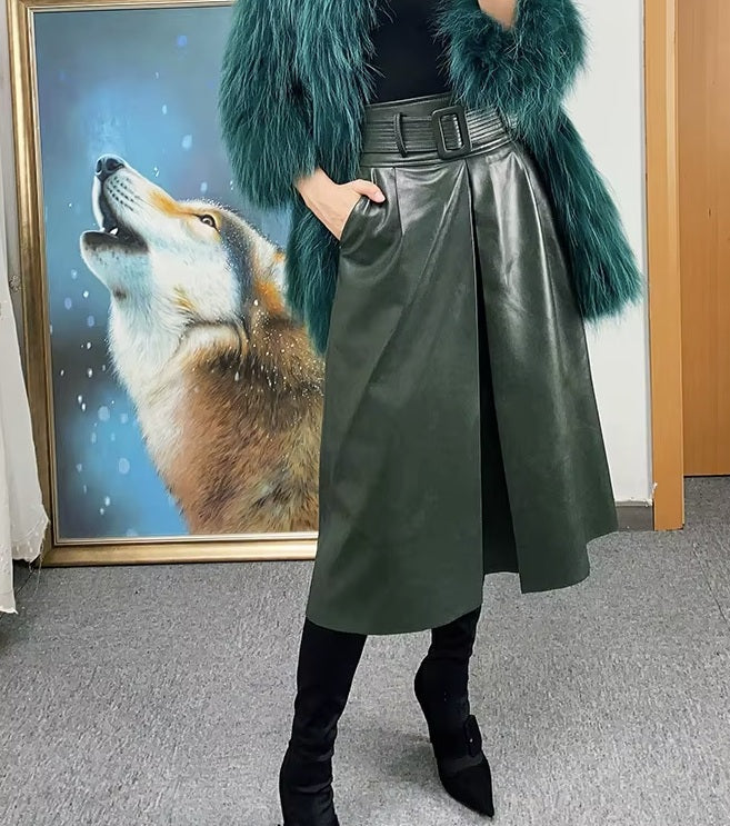 Women's Leather Midi Skirt in Lunar Green. A refined A-line silhouette with a structured waistband, deep center box pleat, and quilted belt, balancing modern elegance with effortless movement. Borcelleclothes.