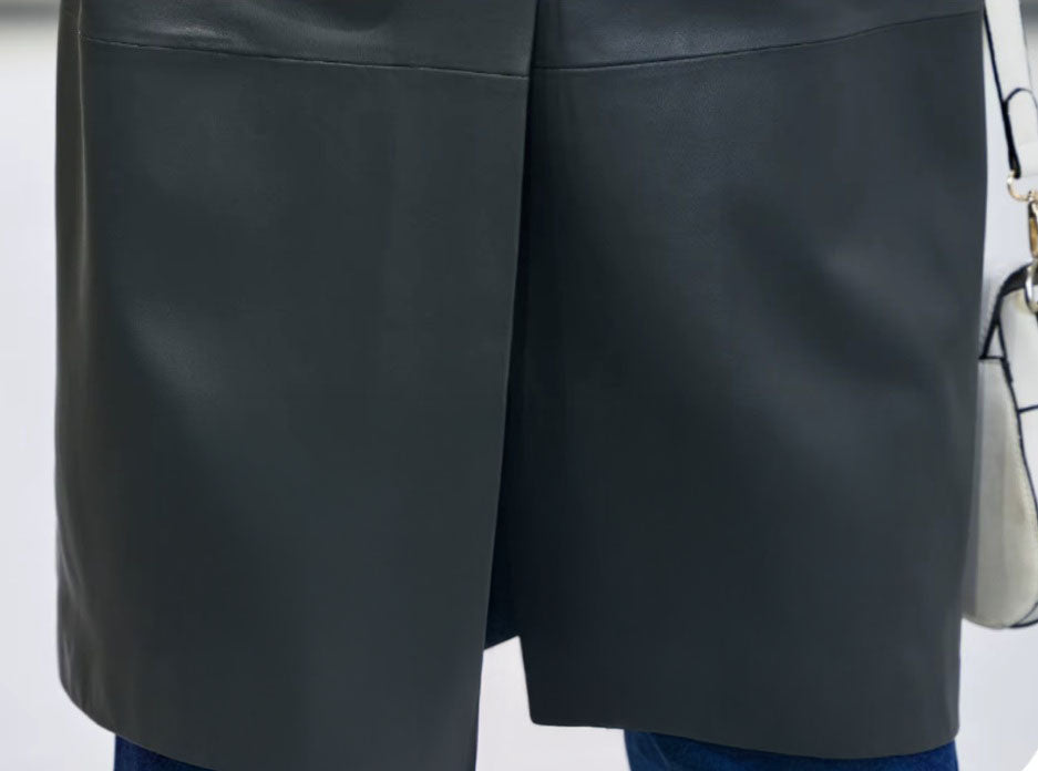 Women's Leather Outer Space Trench. Close-up of the back vent, ensuring fluidity of movement without sacrificing structure. Borcelleclothes.