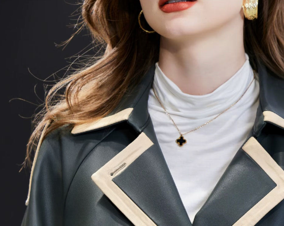 Women's Leather Outer Space Trench. Model showcases the structured collar, contrast leather trim, and double-breasted design. Borcelleclothes.